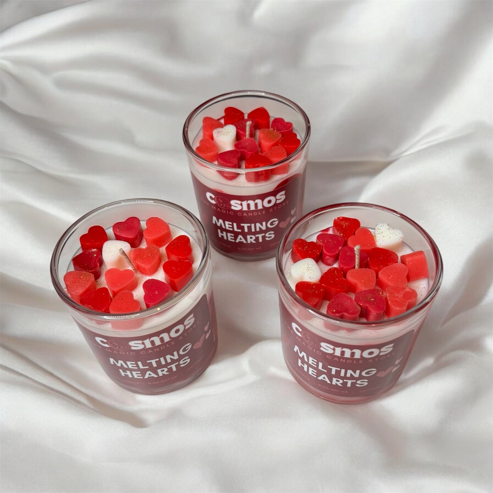 aesthetic photo of three melting hearts candles