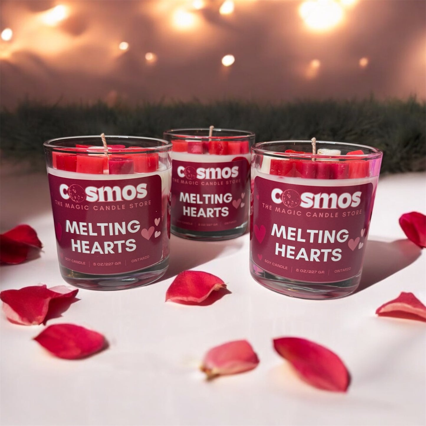 romantic photo of three melting hearts candle